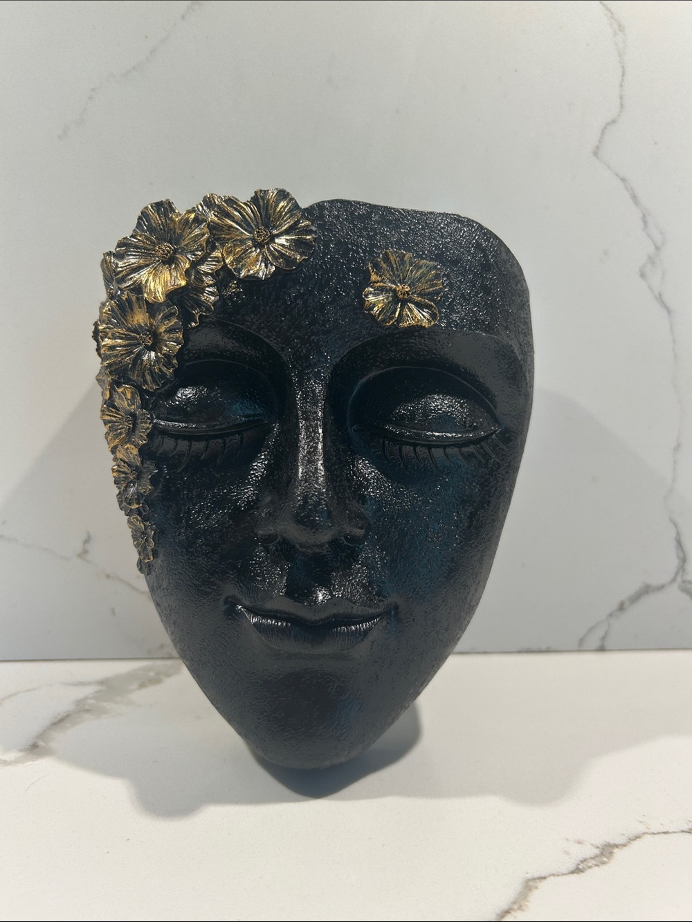 Decorative Black Face Wall Sculpture with Gold Flower Accents